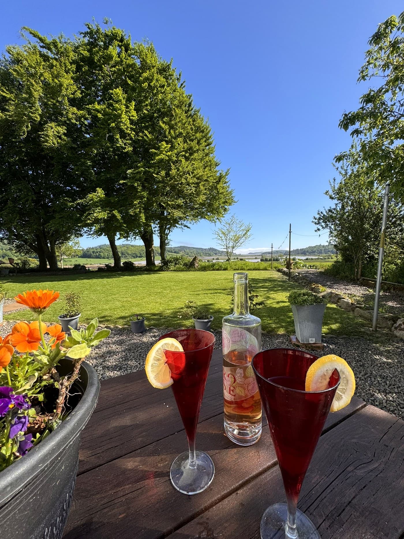 Outdoor table setting looking across the garden towards the Urr Estuary